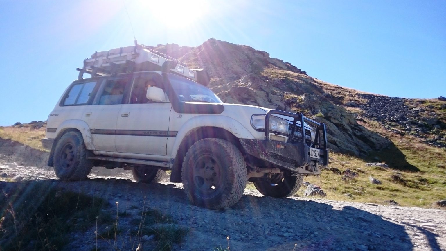Toyota Land Cruiser on a high mountain track in the French Alps