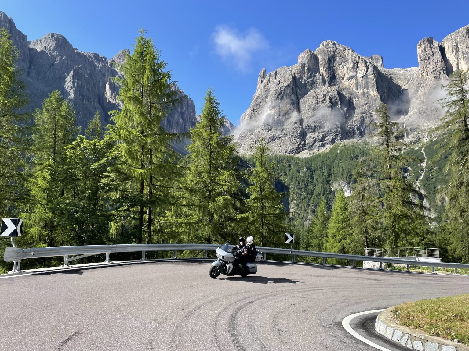 Rider on a hairpin bend below the Sella group in the Dolomites