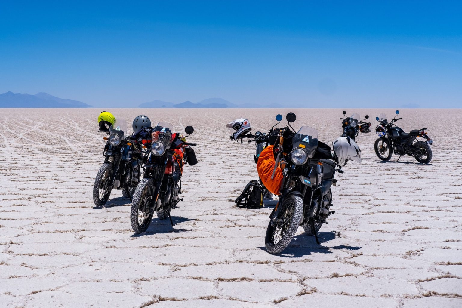 Motorcycles parked on the white salt of the Salar de Uyuni, Bolivia