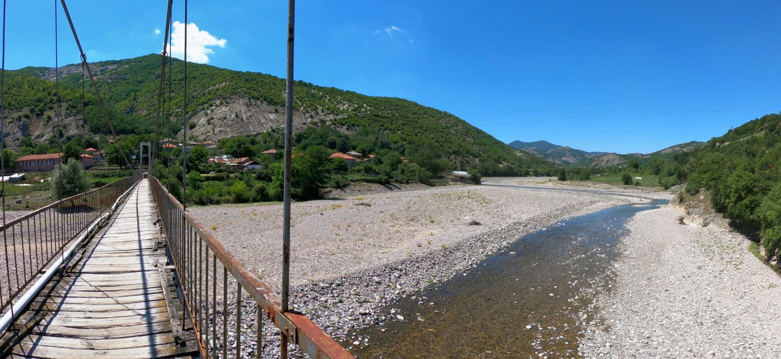 Suspension footbridge over a river in a Bulgarian mountain valley