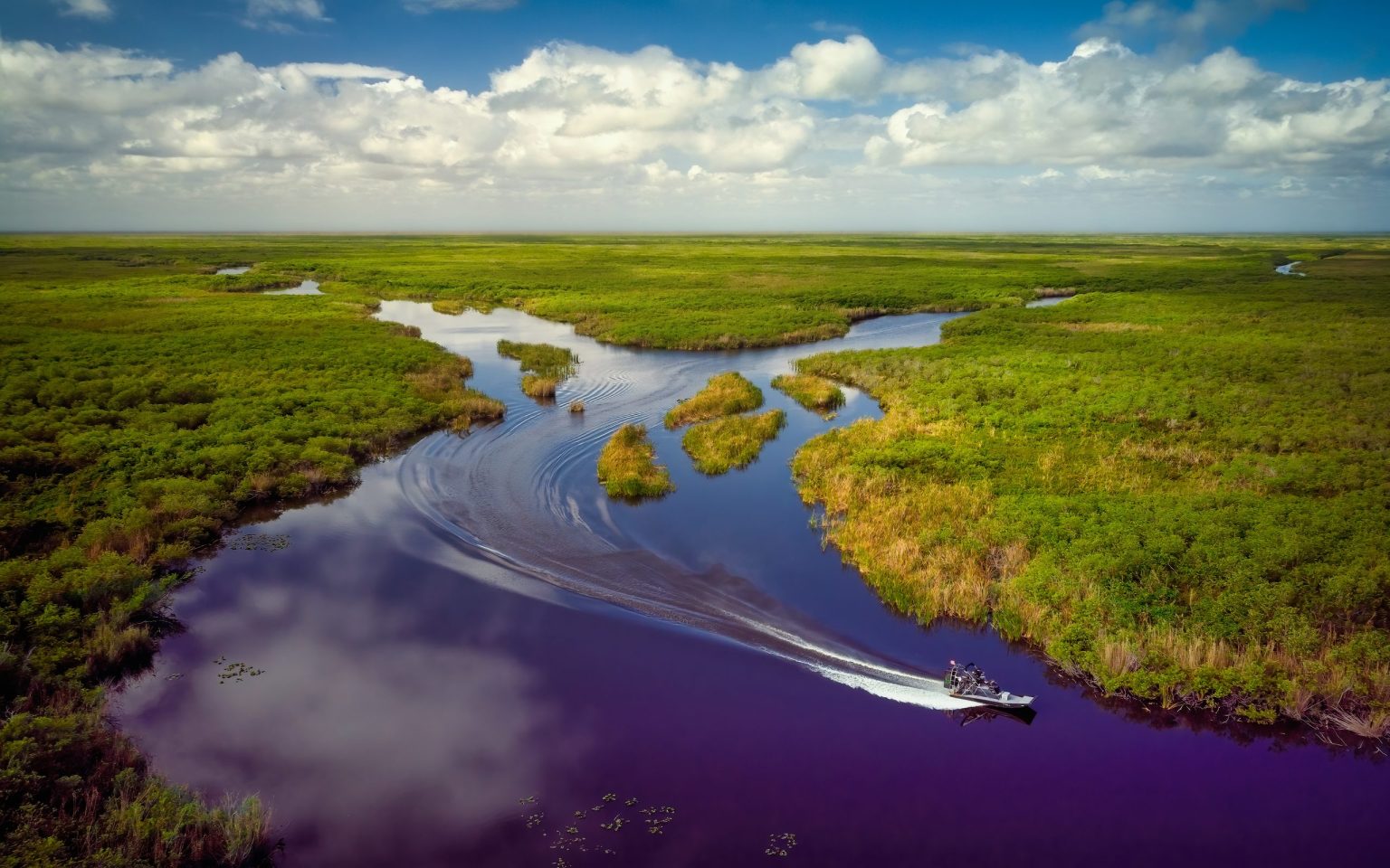 Airboat cutting through the sawgrass of the Florida Everglades