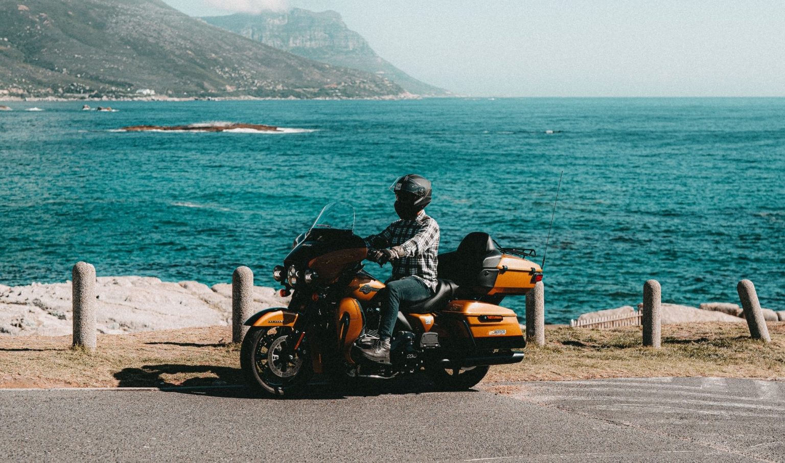 Rider on a touring motorcycle on the coast road near Cape Town