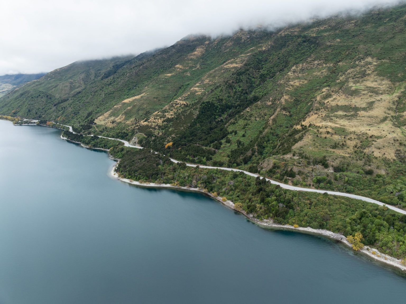 Aerial view of the road winding along Lake Wanaka, New Zealand