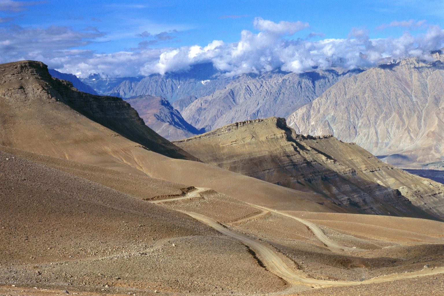 Gravel road through arid Himalayan mountains