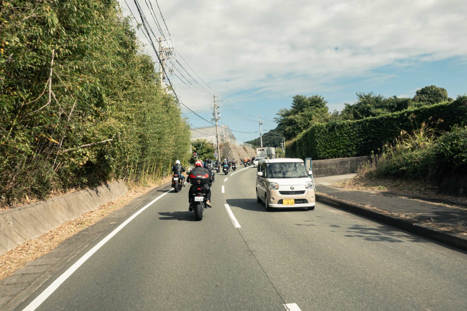 Motorcycle riders on a country road in central Japan