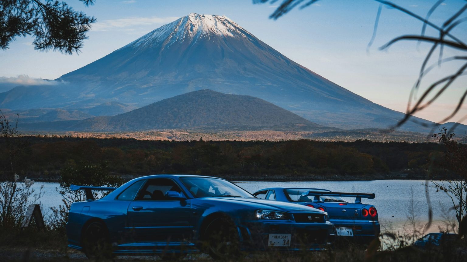 Blue sports car below Mount Fuji, Japan
