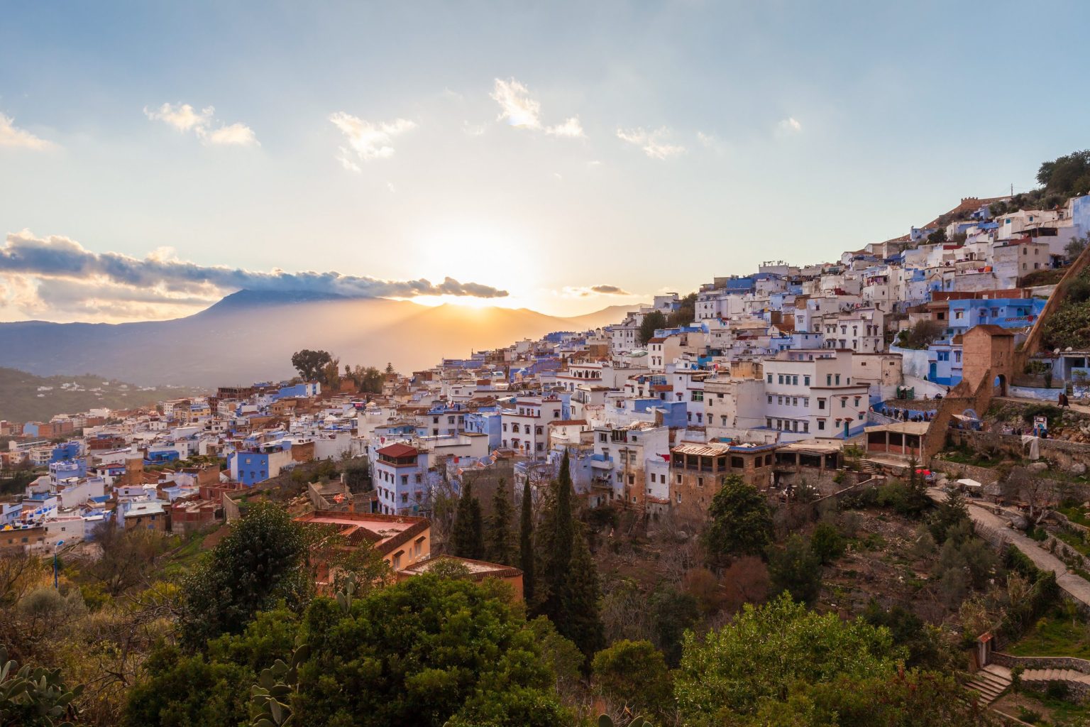 Chefchaouen at sunset beneath the Rif mountains