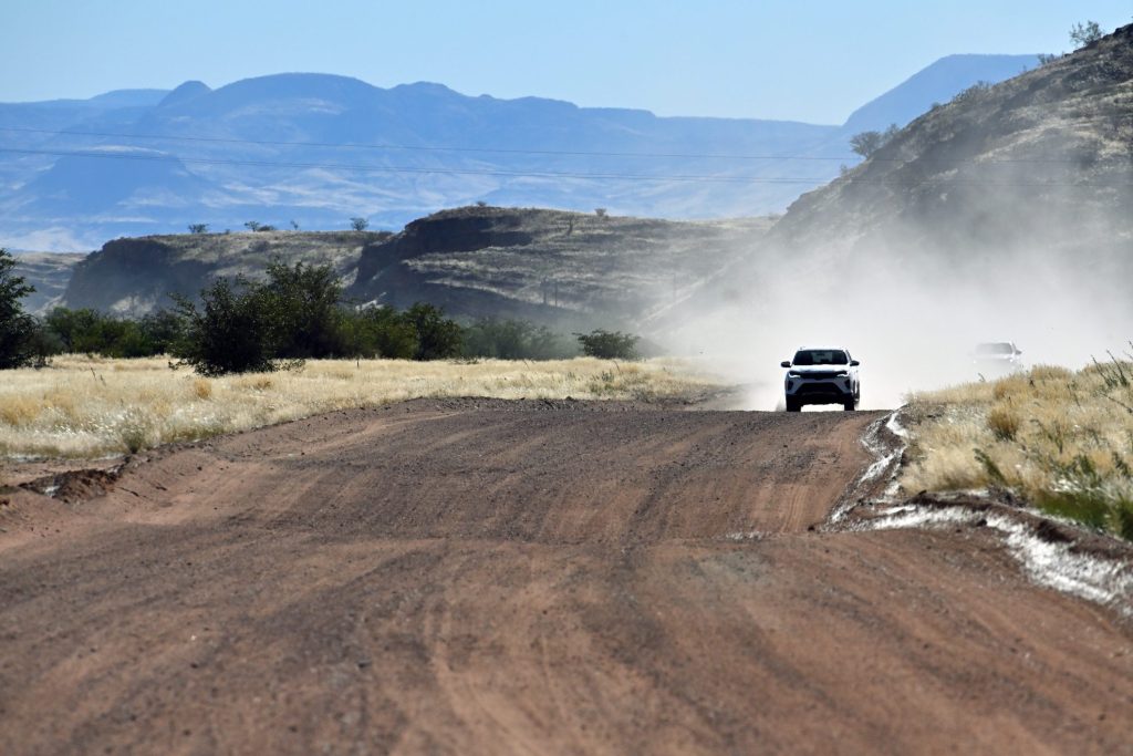 A 4x4 on a gravel desert road in Namibia