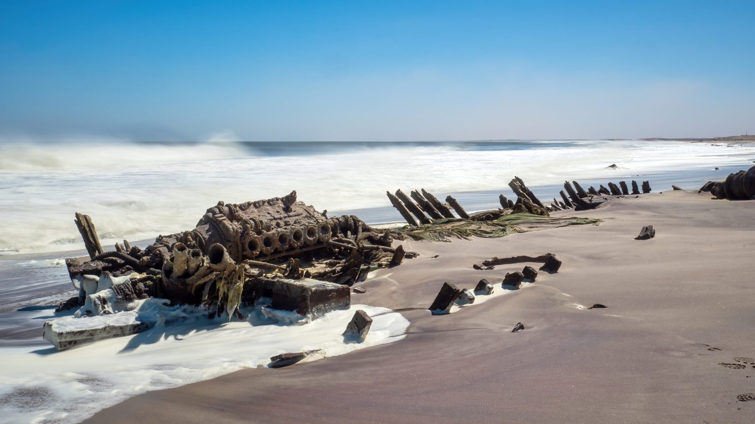 Shipwreck in the Atlantic surf on the Skeleton Coast, Namibia