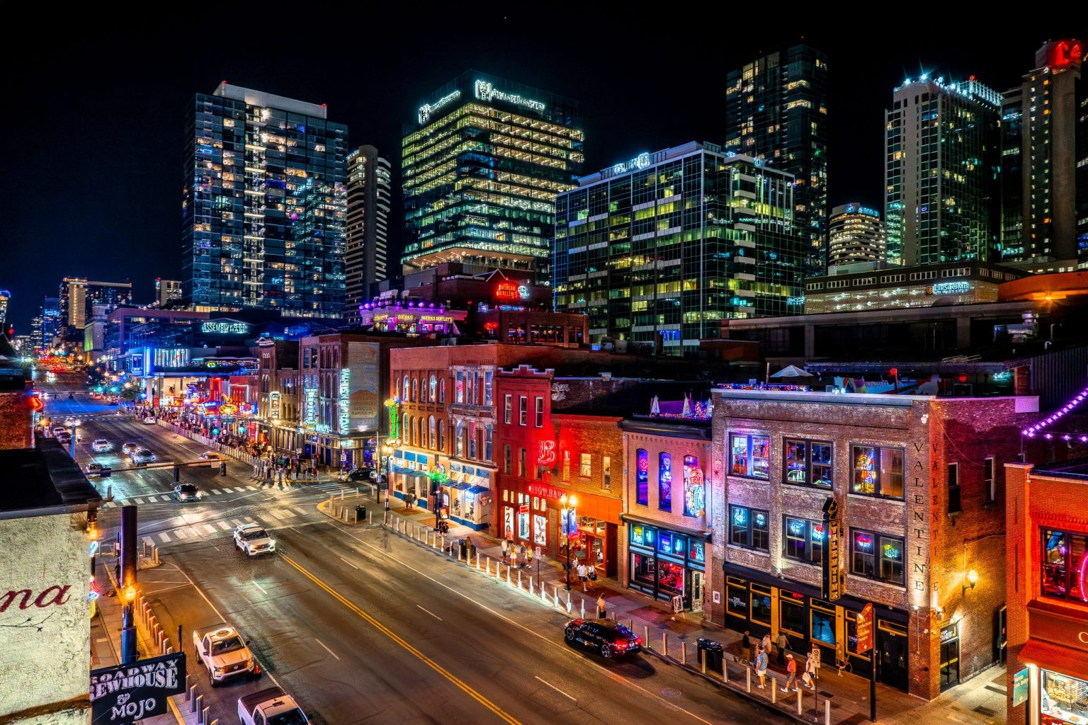 Neon-lit honky tonks on Nashville's Lower Broadway at night