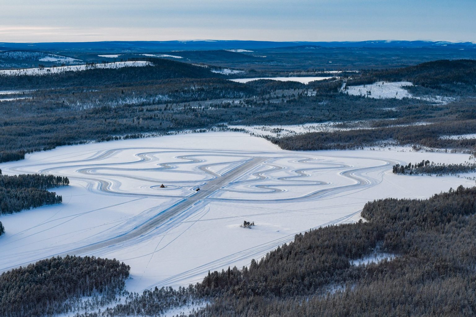 Aerial view of an ice driving track on a frozen lake in Lapland
