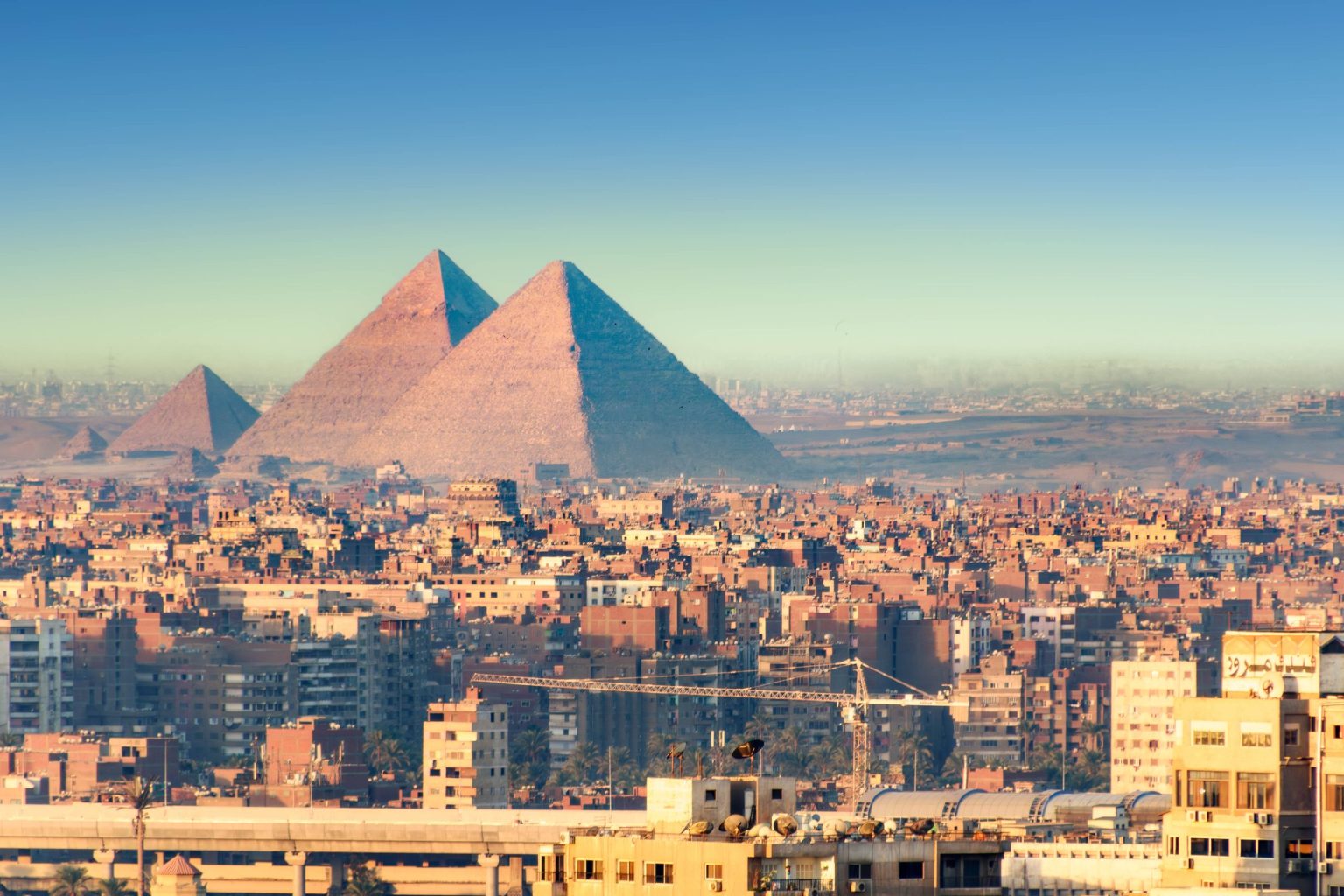 The Pyramids of Giza rising above Cairo