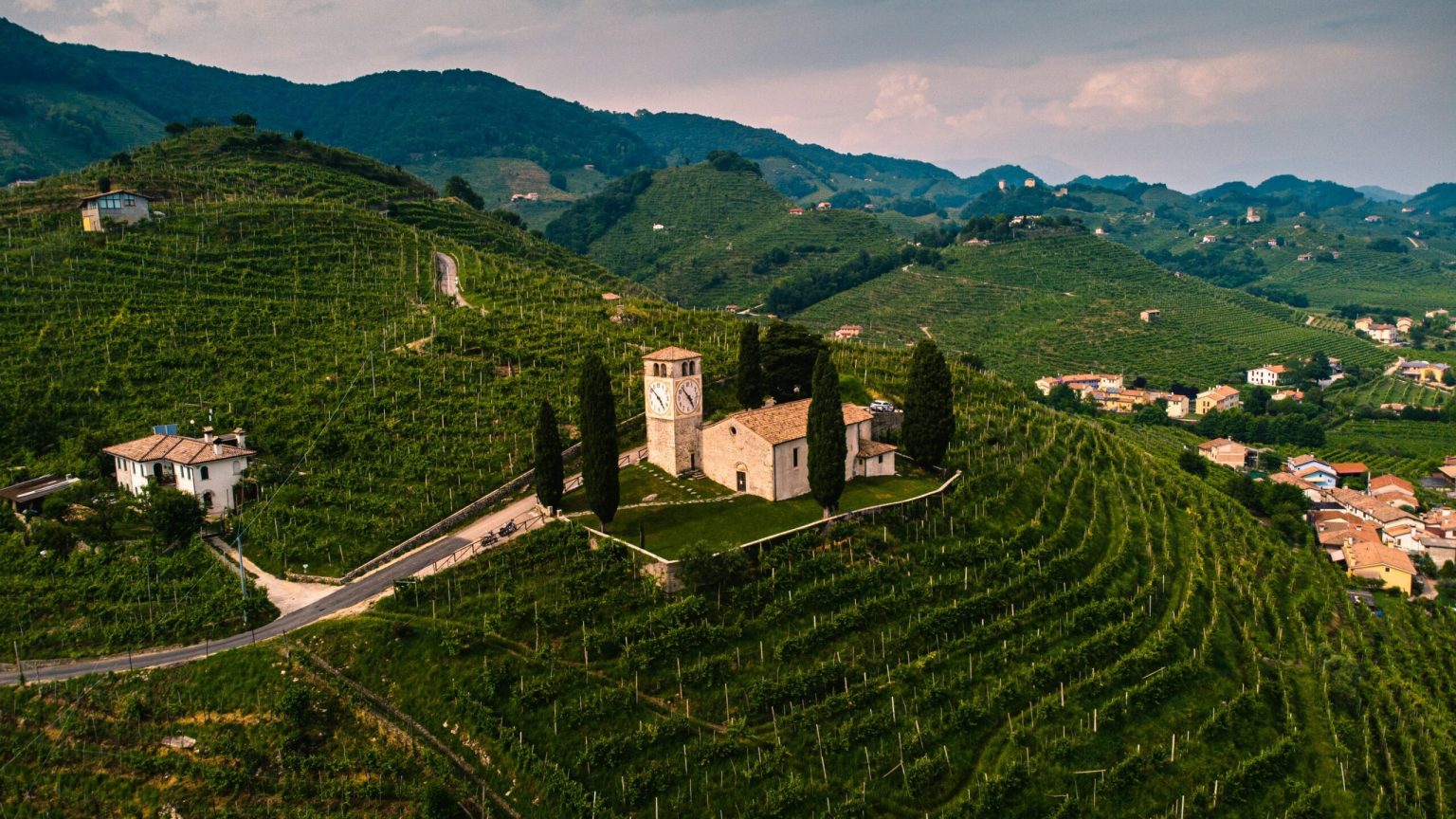 Hilltop church among terraced Prosecco vineyards in the Veneto