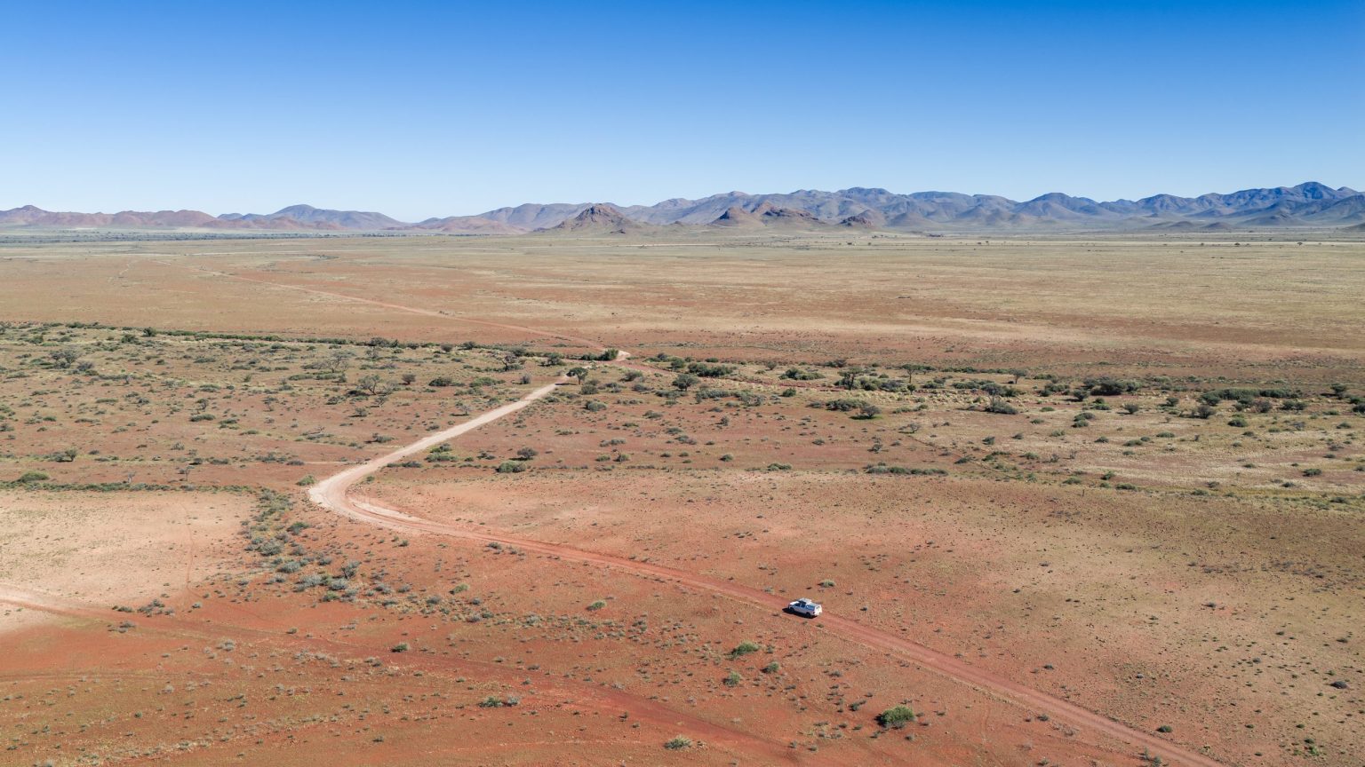4x4 on a desert track across the NamibRand plains, Namibia