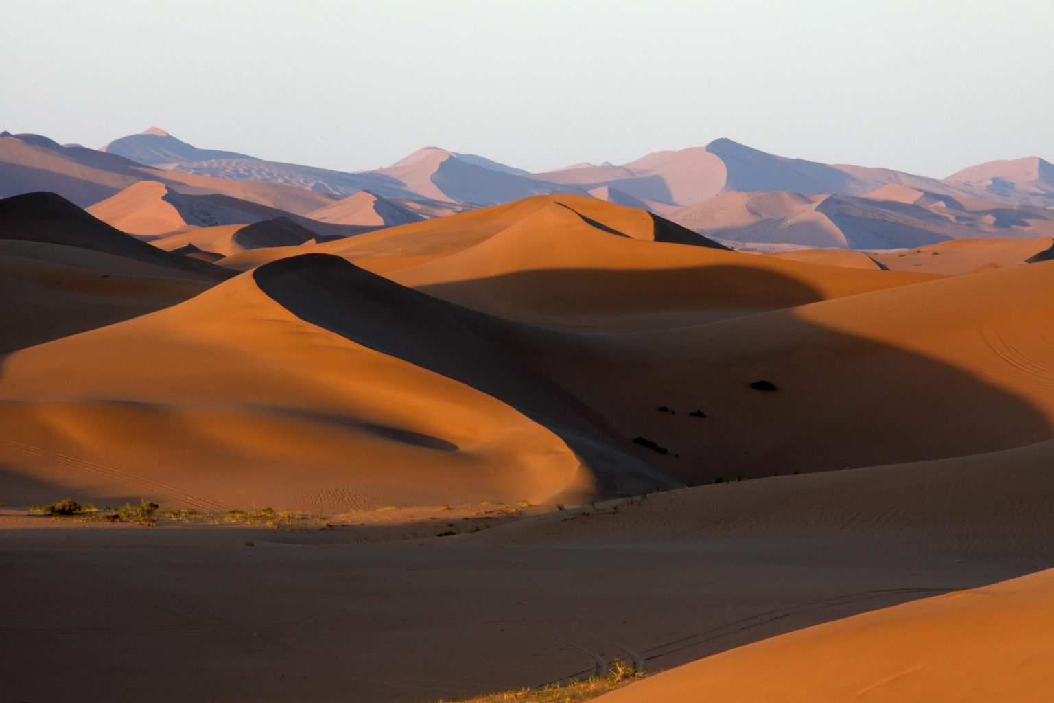 Sand dunes beneath mountains in the Gobi Desert, Mongolia