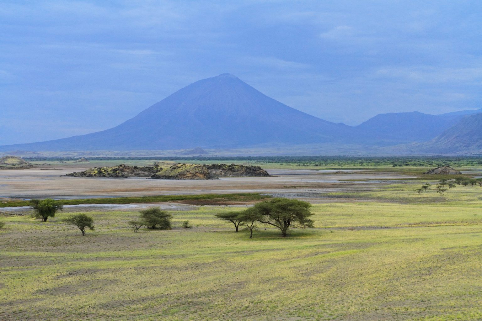 Ol Doinyo Lengai volcano rising above the plains near Lake Natron, Tanzania