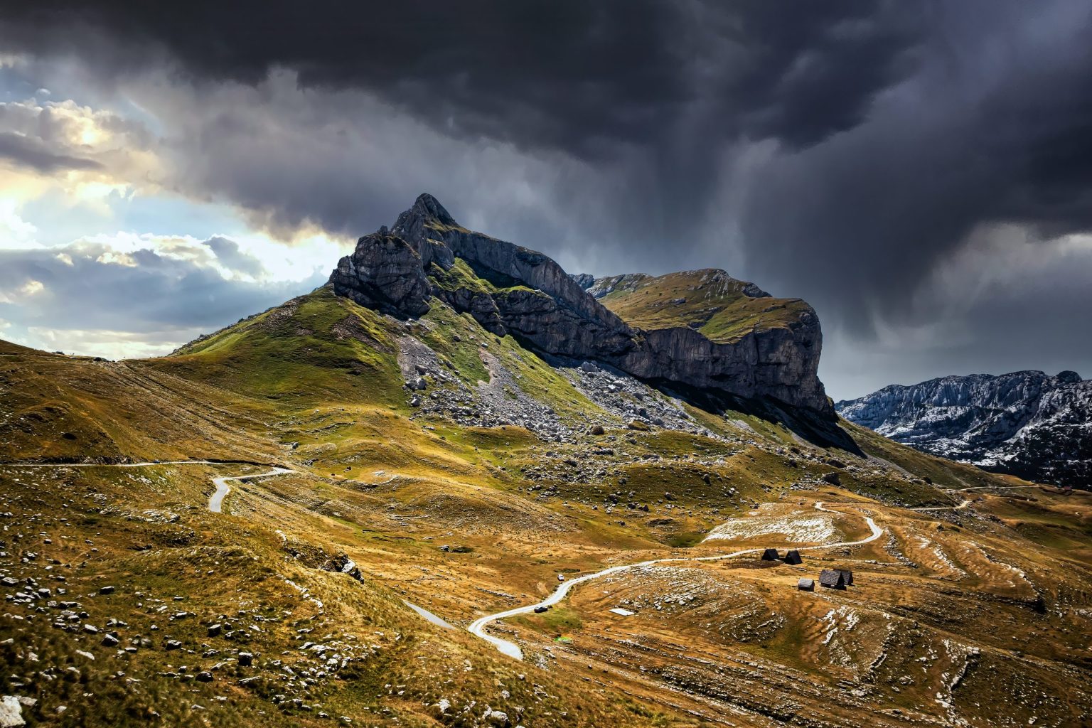 Road across the Durmitor plateau under storm clouds, Montenegro